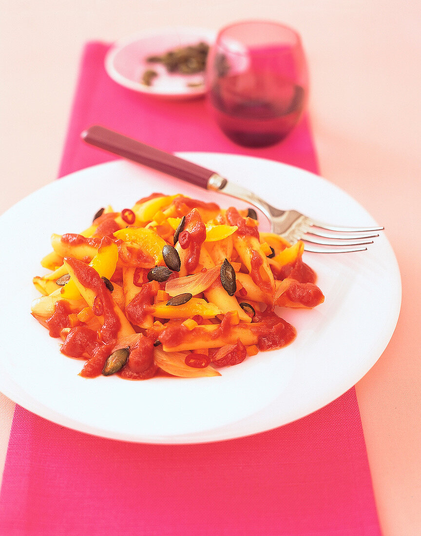 Pasta with tomato and apricot sauce on plate