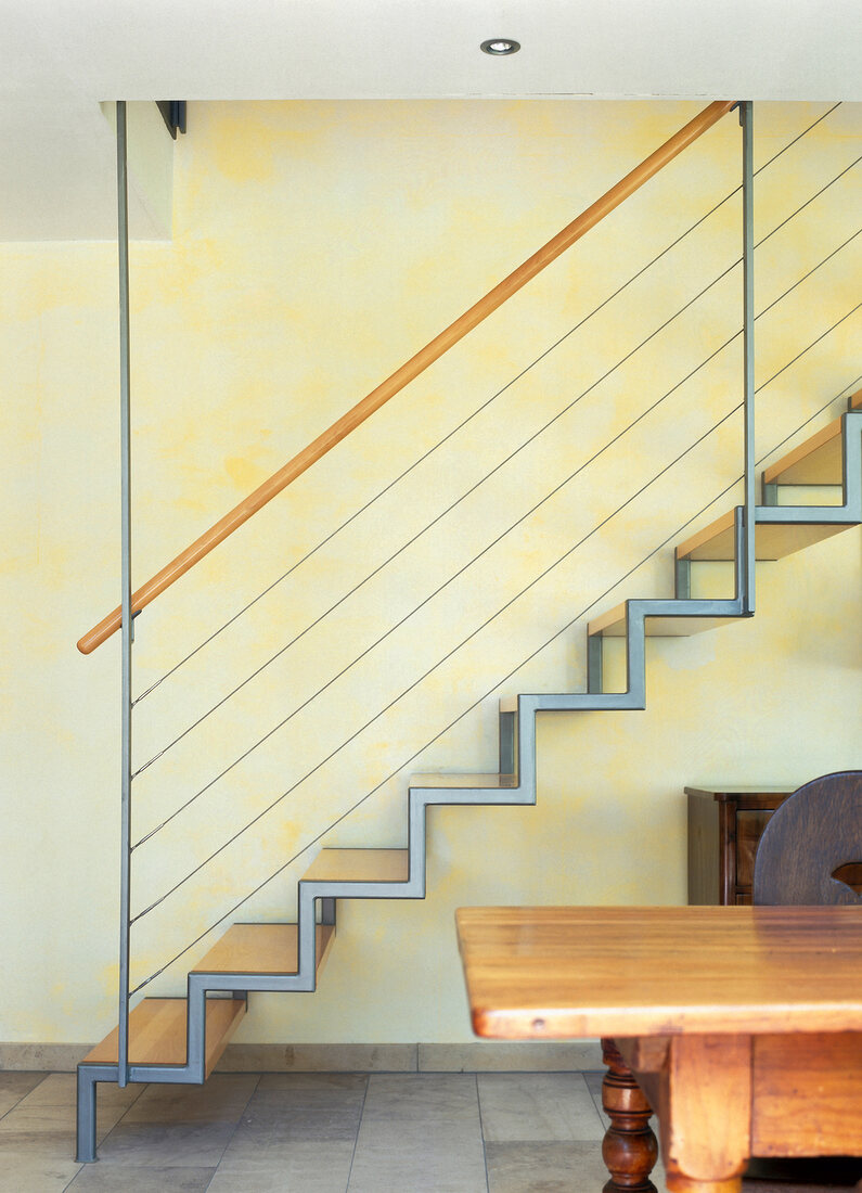 View of staircase with beech handrail