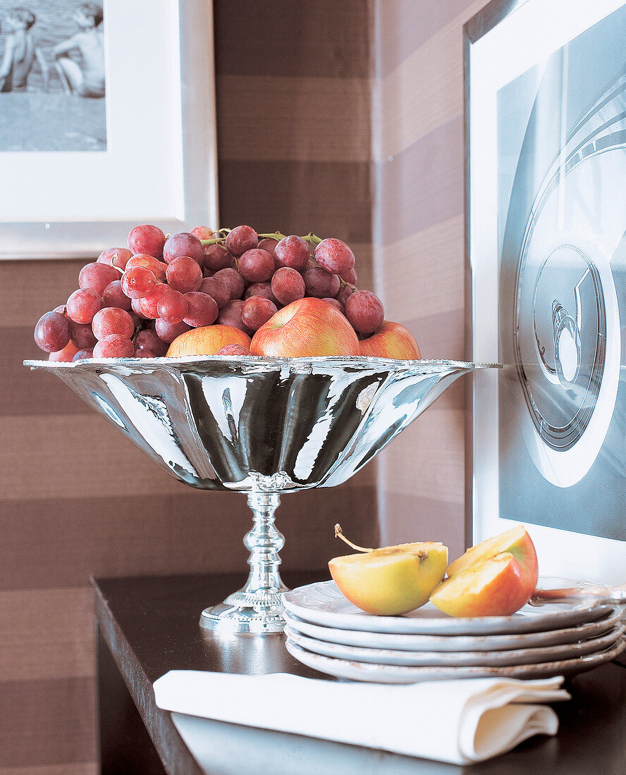 Silver fruit stands with fruits on plate