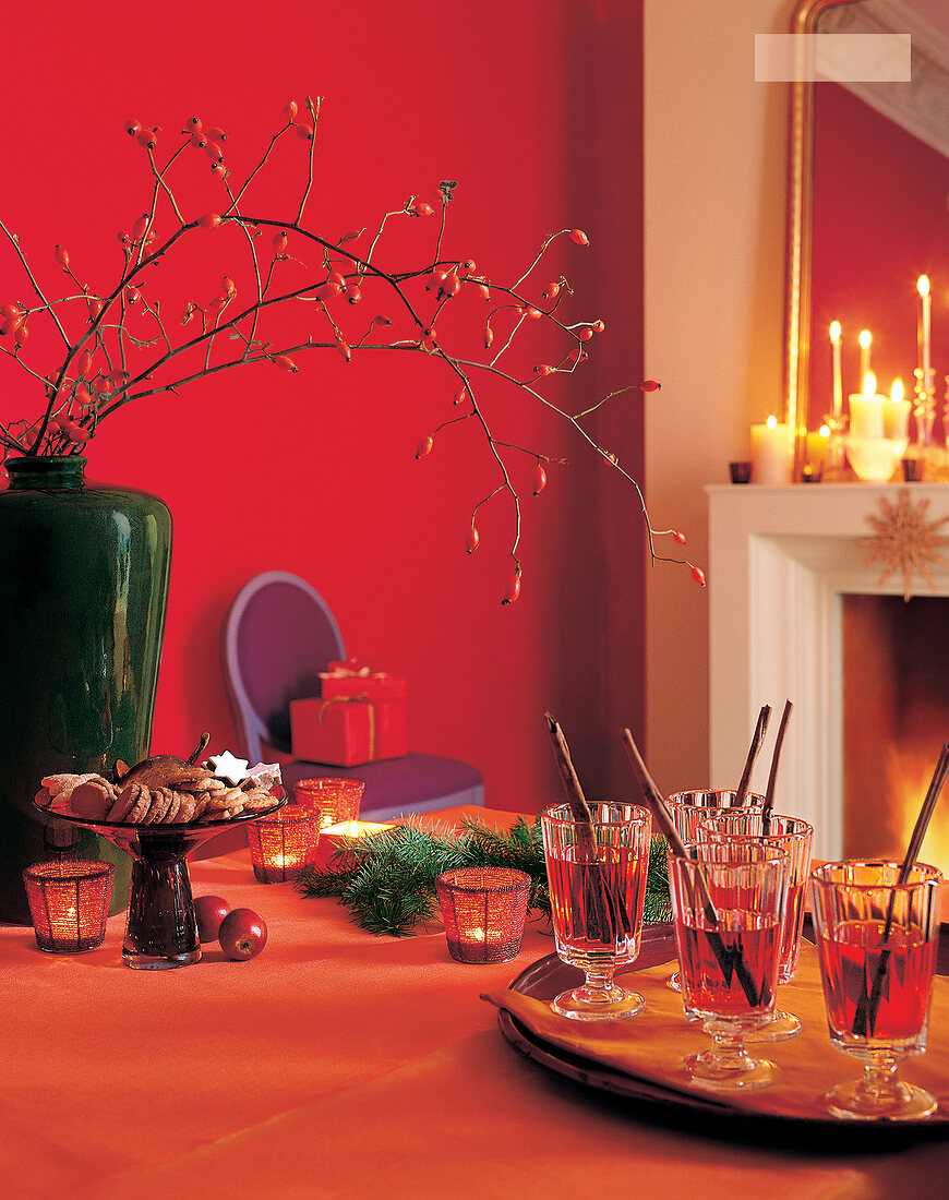 Christmas table laid with cookies, drinks and Christmas decoration