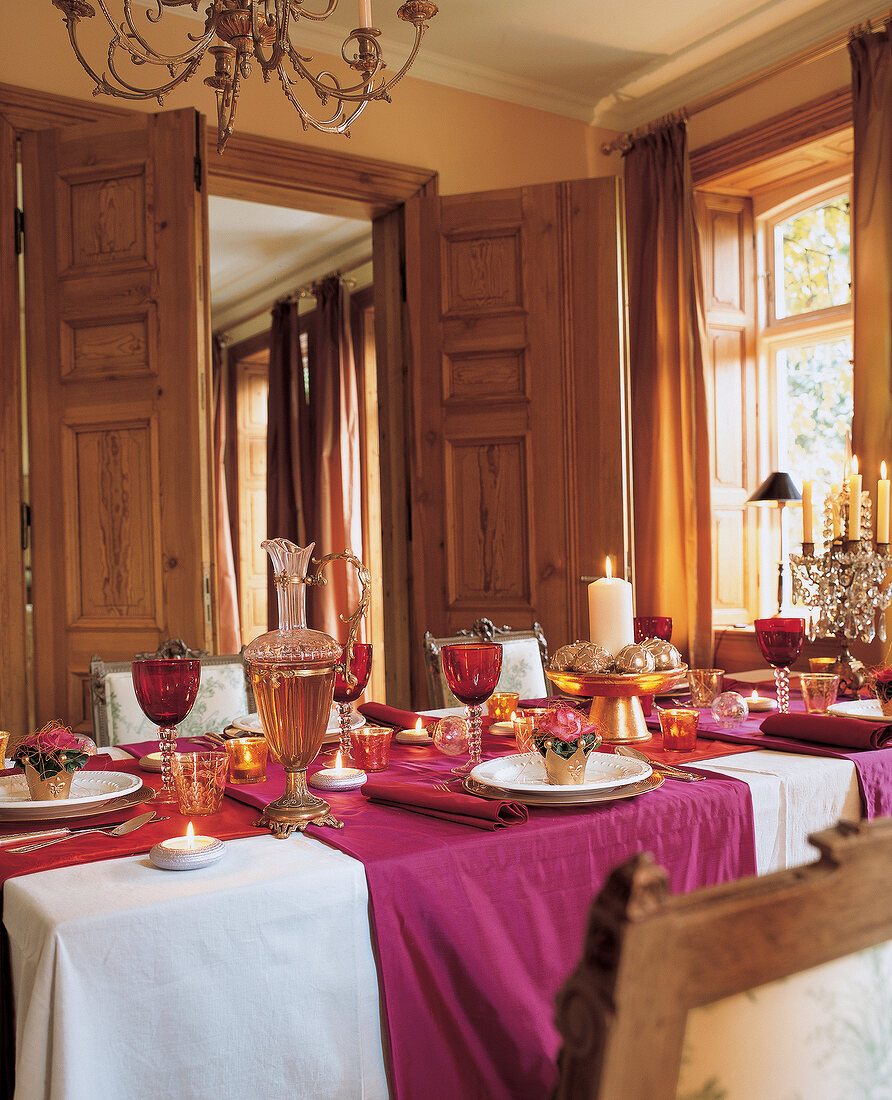 Festively decorated table with candles for Christmas