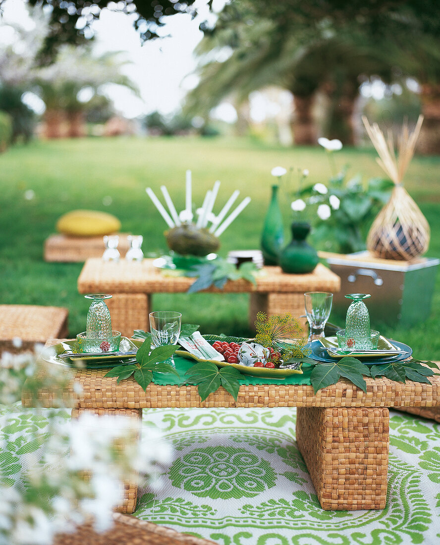 Table decorated with leaves and glass in Asian style