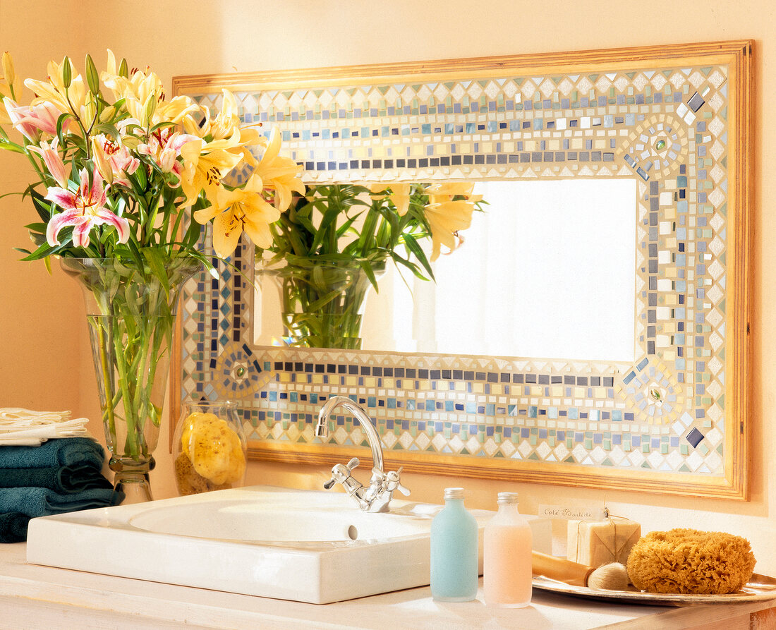 Bathroom with oriental patterned mosaic mirror near wash basin