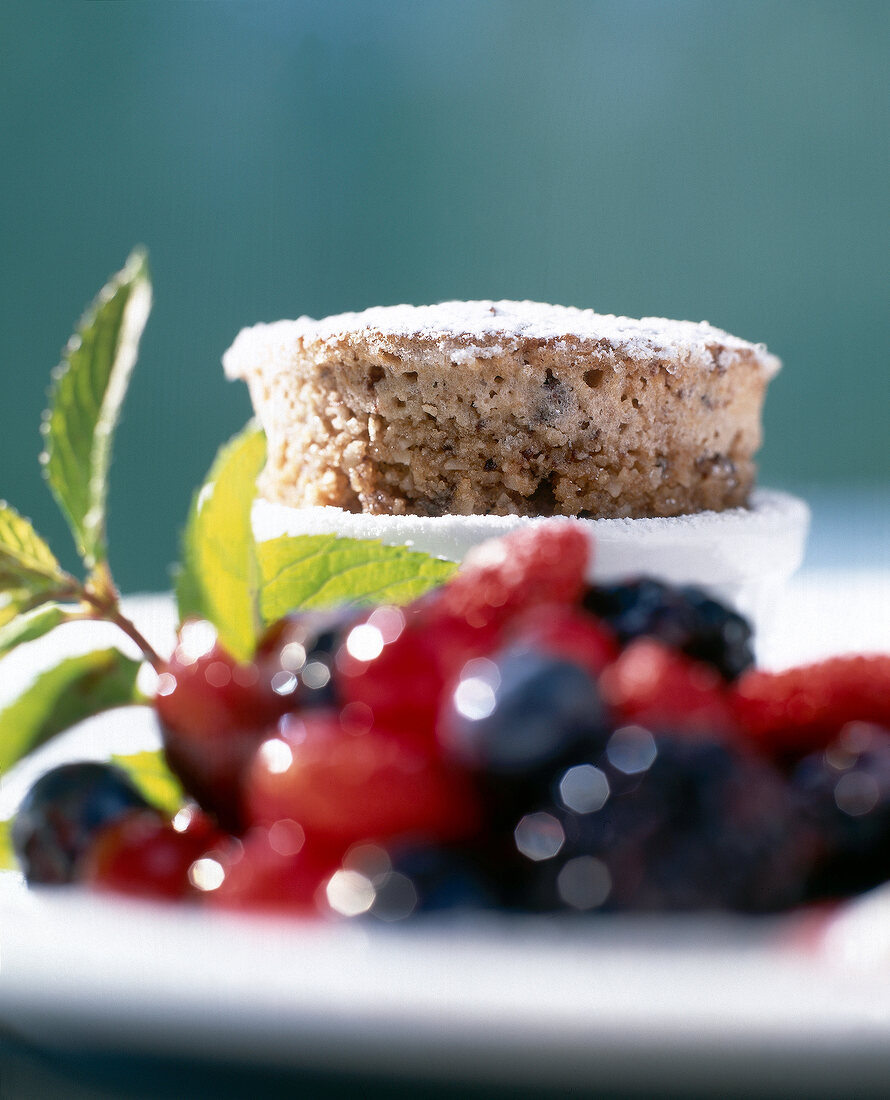 Rumfort souffle dusted with powdered sugar and berry salad