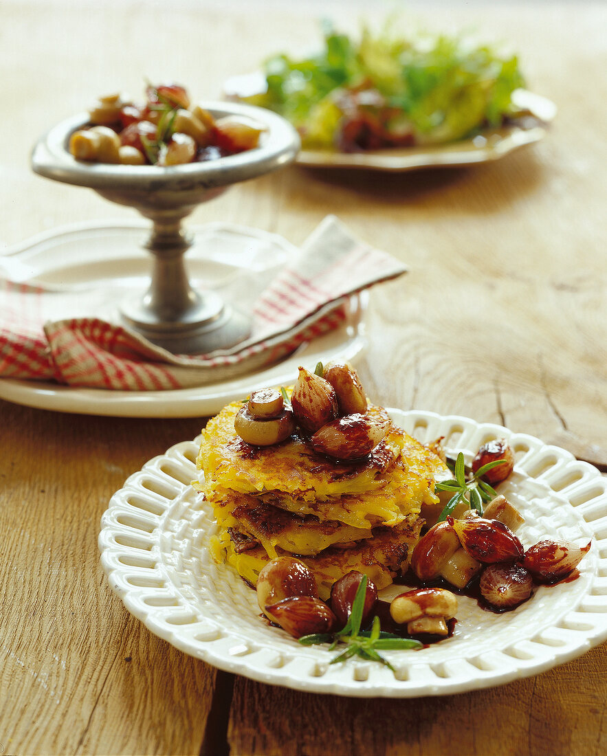 Hash brown with mushrooms and red onions on plate