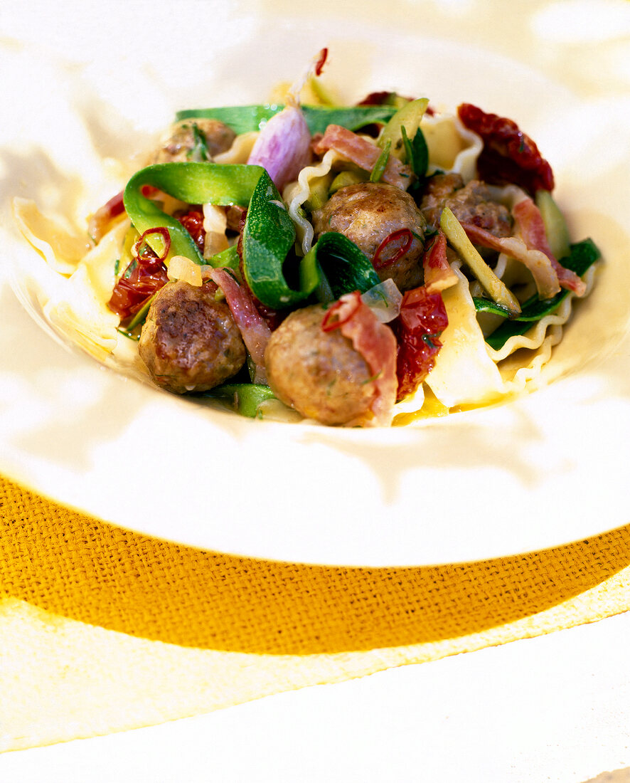 Close-up of lamb meatballs with noodles on plate