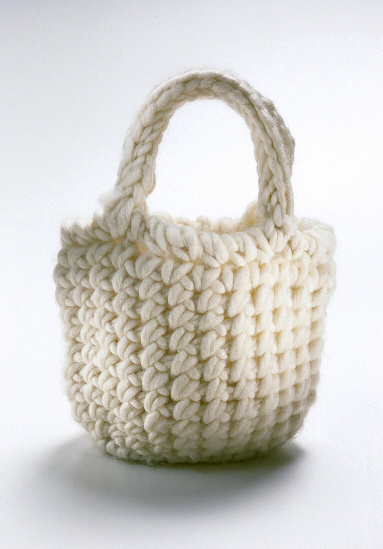 White knitted bag on white background