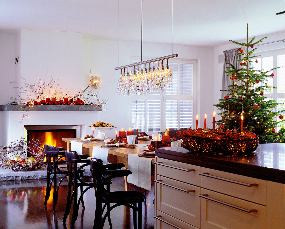 Kitchen and dining area decorated with candles and Christmas tree for Christmas