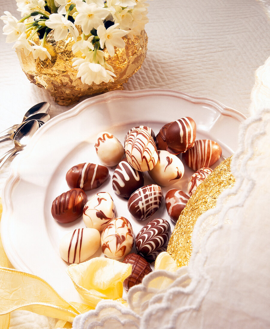 Marzipan eggs decorated with chocolate glaze plate