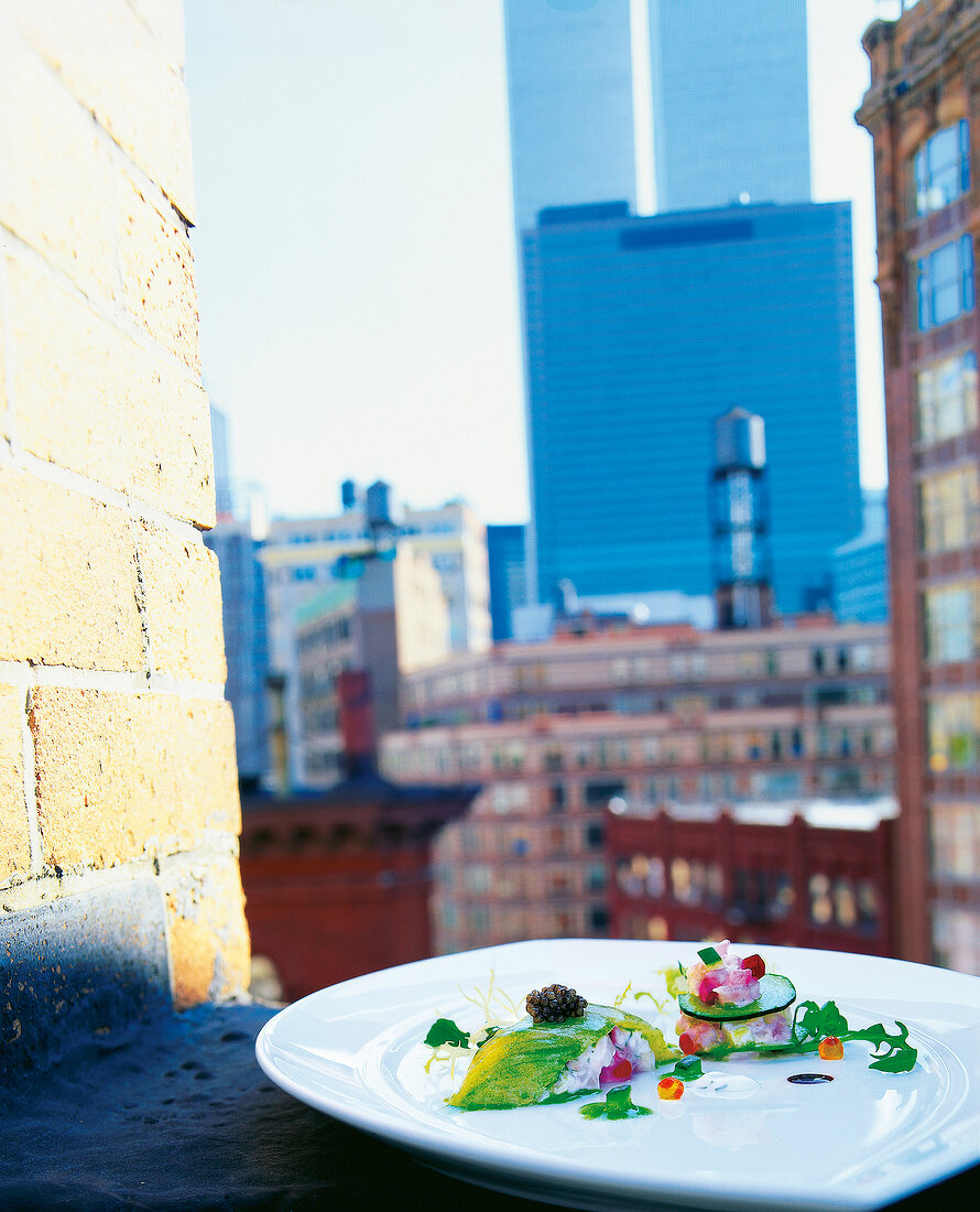 Mackerel salad with cucumber and lettuce vinaigrette on plate