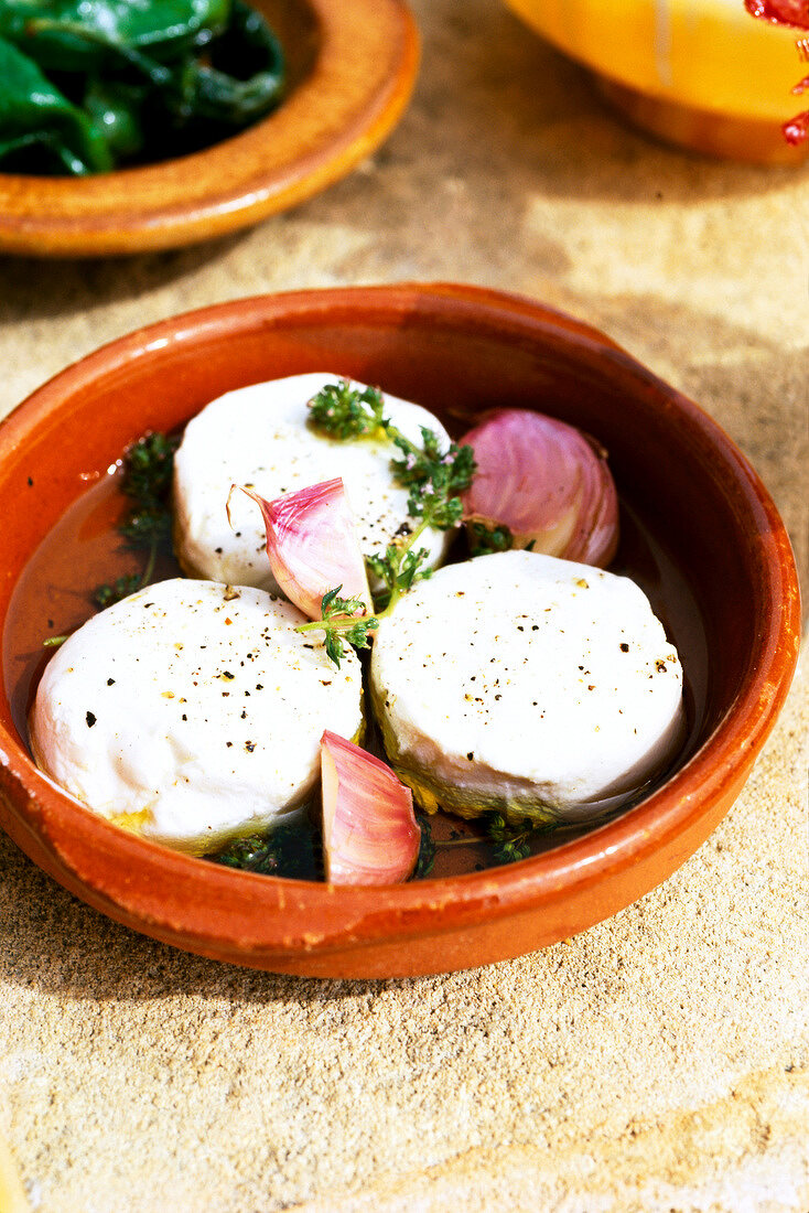 Baked goat cheese in bowl, Tapas