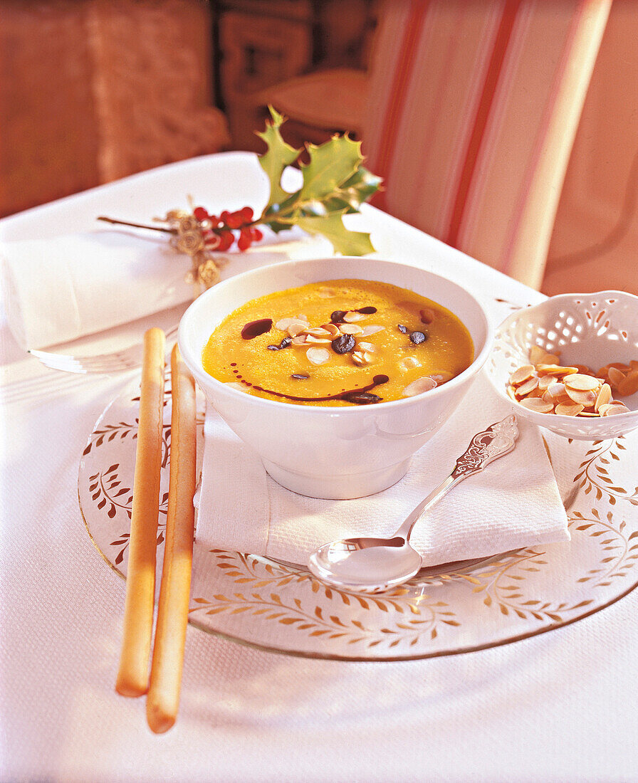 Soup with pumpkin and orange juice in bowl, Christmas