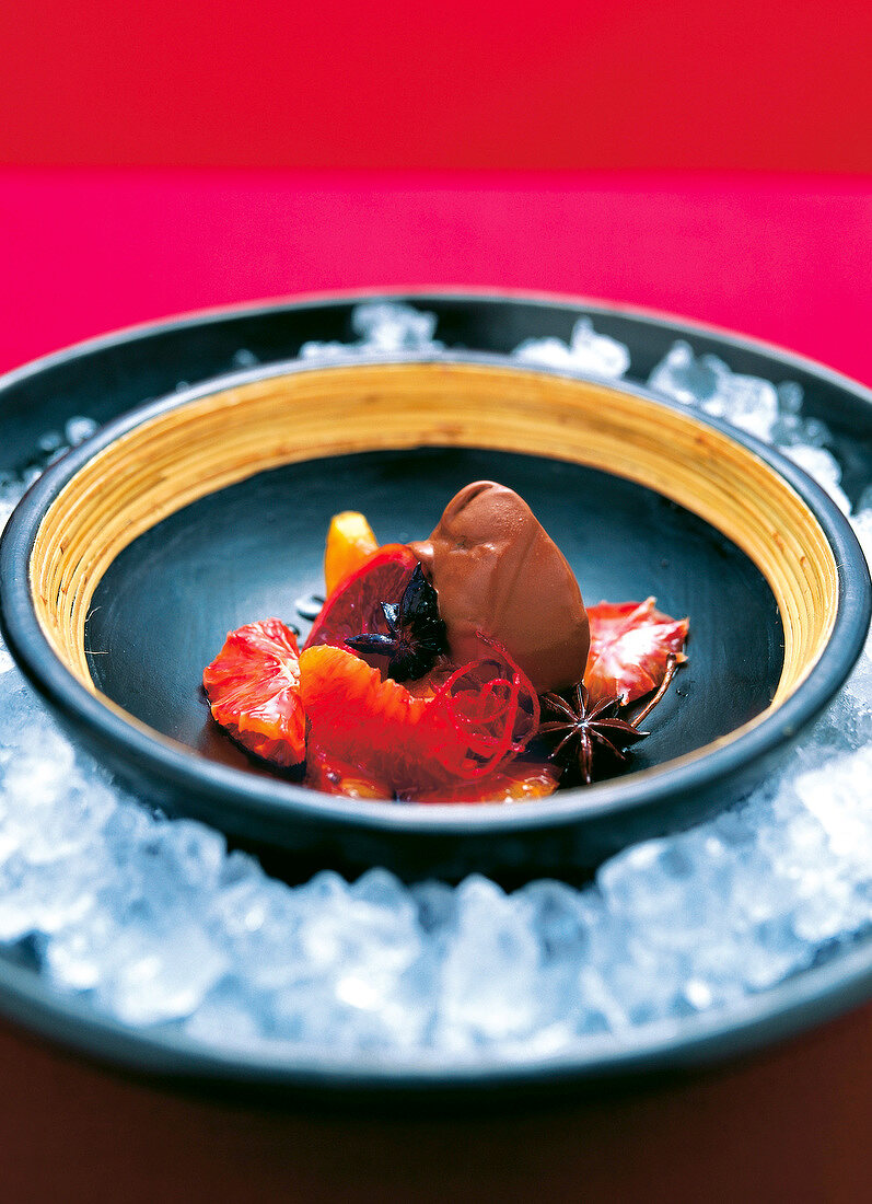 Close-up of chocolate with ginger in bowl placed over ice