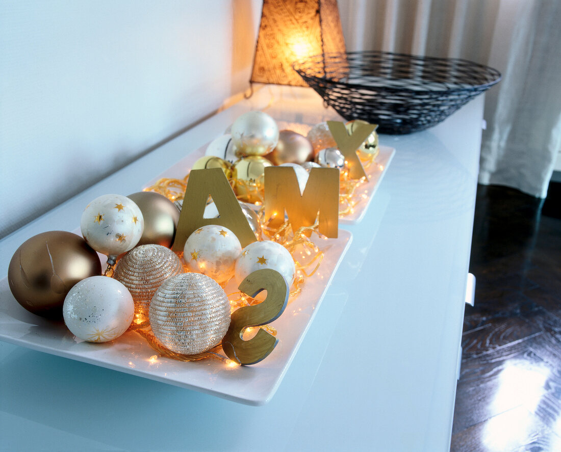 Illuminated bowl with Christmas balls and gold letters