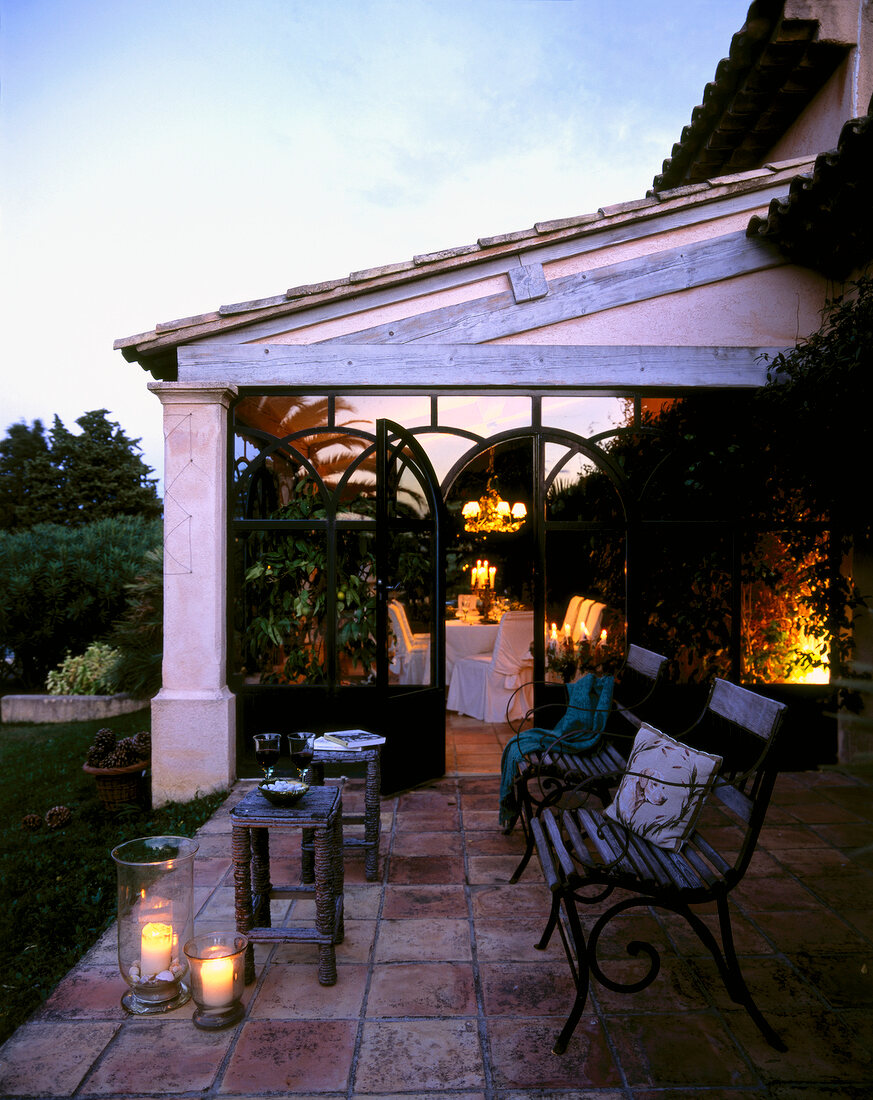 Benches with illuminated candles at conservatory