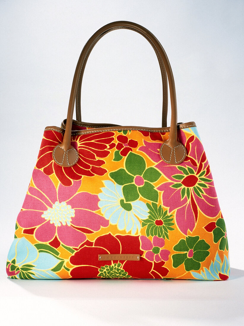 Close-up of colourful handbag with floral pattern