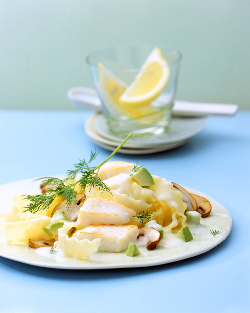 Noodle with avocado and zander sauce on plate