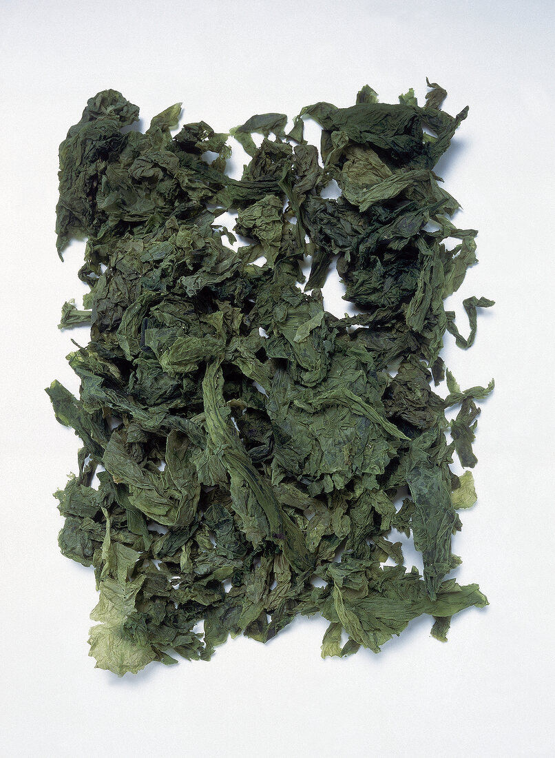 Close-up of dried sea lettuce on white background