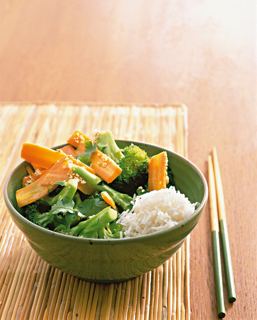 Asian vegetables with rice in bowl