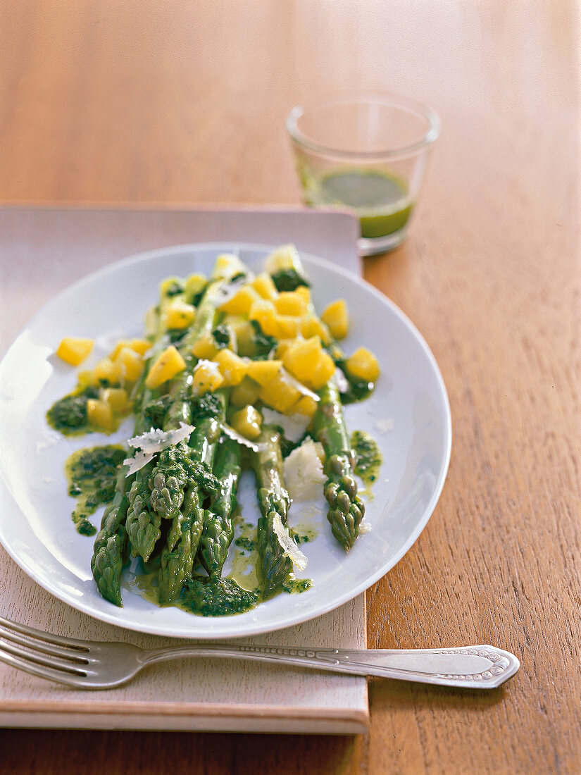 Asparagus with salsa verde sauce on plate