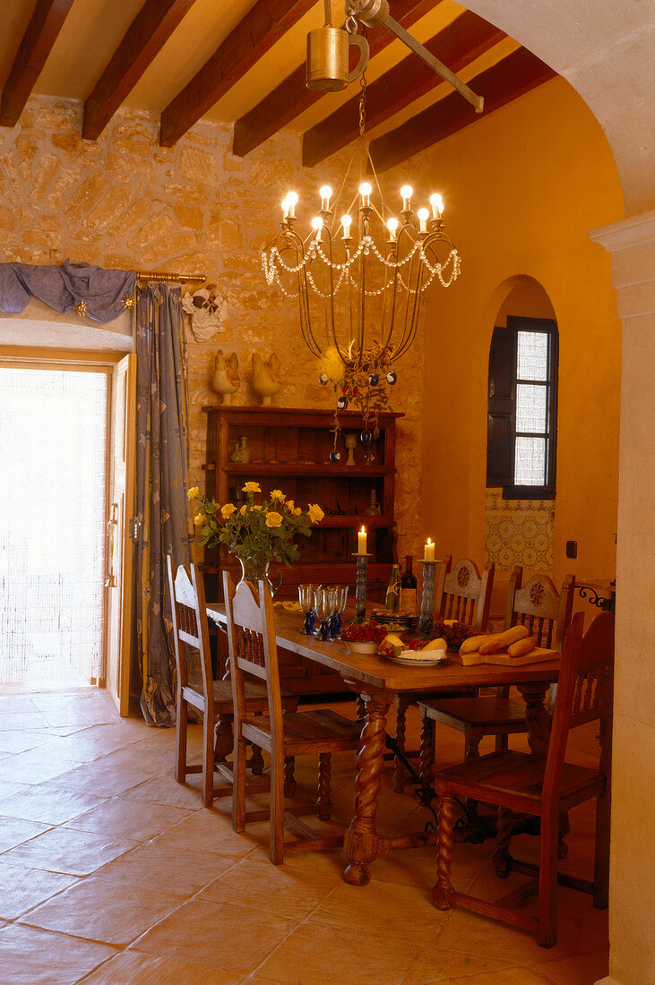 Rich oak furniture in dining room at Majorcan country house, Spain