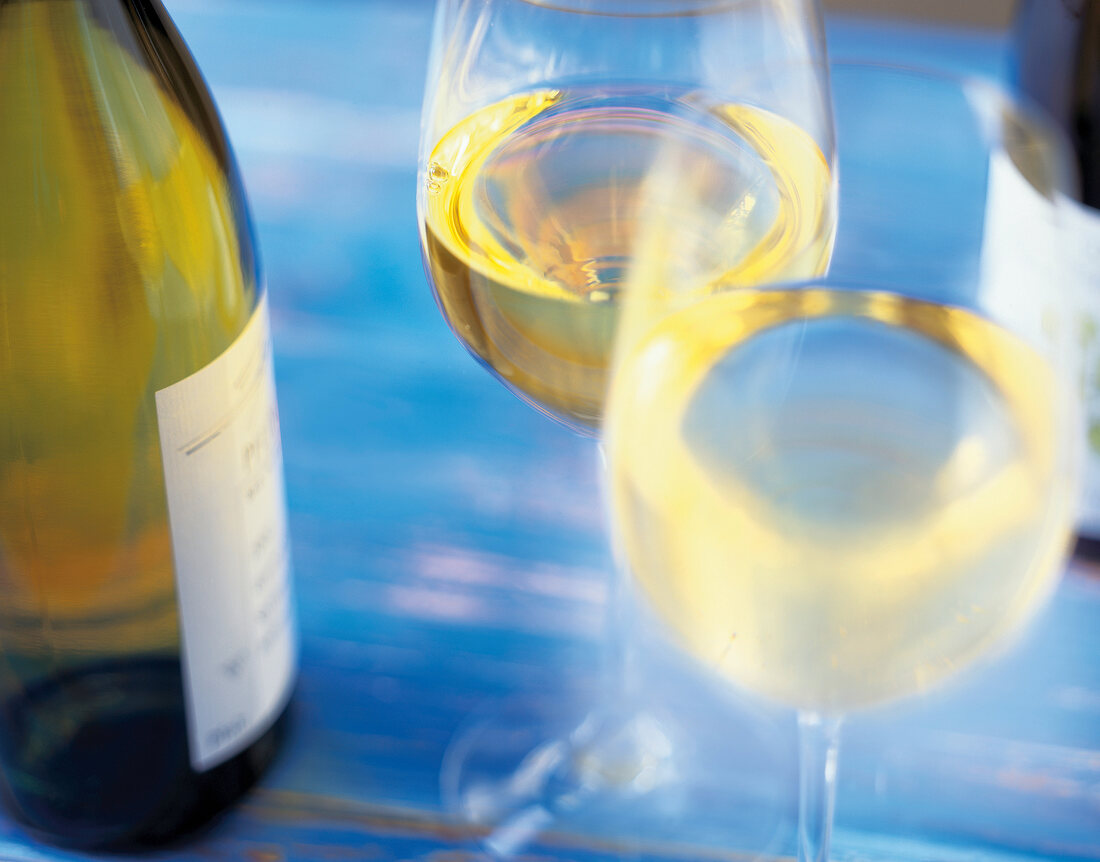 Close-up of glasses with white wine