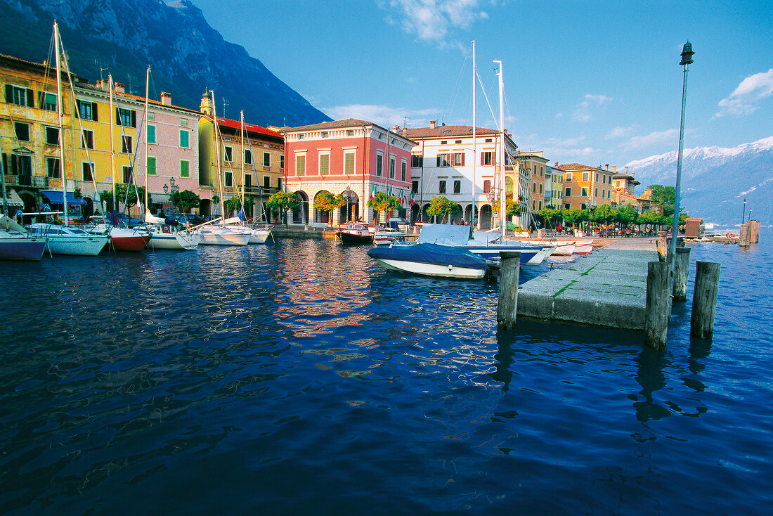Boats moored on harbour at Lake Garda in Gargnano, Lombardy, Italy