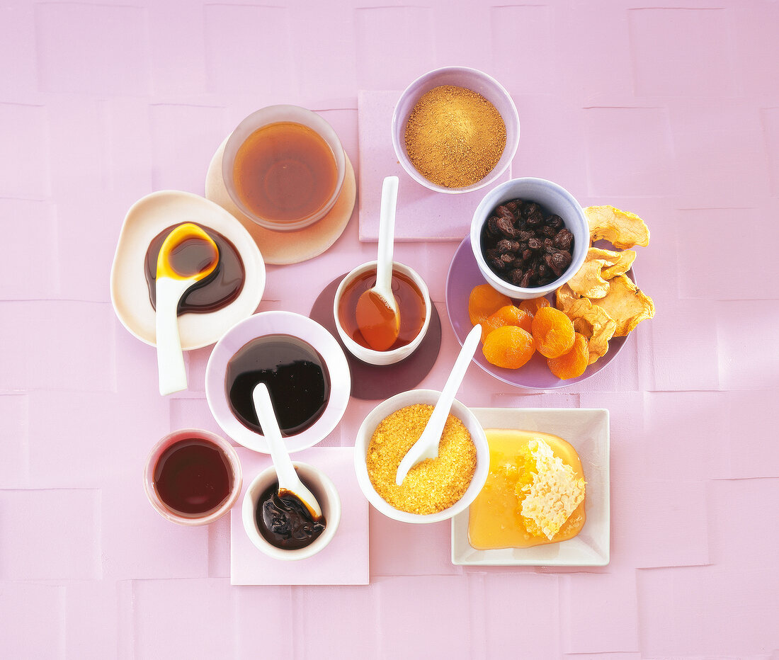 Sweet natural products in trays - sauces, syrup and sugar
