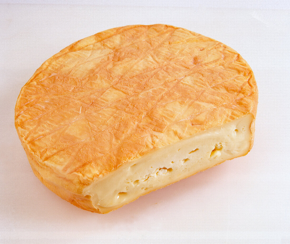 Close-up of muenster cheese on white background