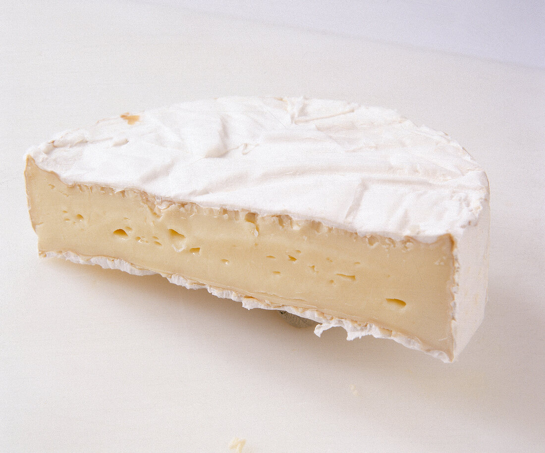 Close-up of camembert on white background