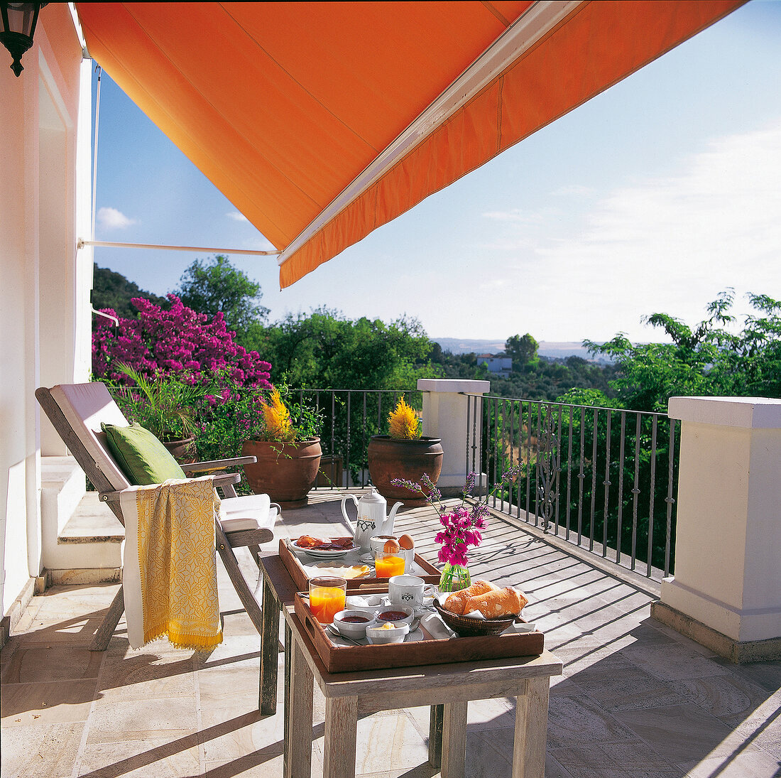 Laid table in balcony of Hotel La Fuente de la Higuera in Malaga, Spain