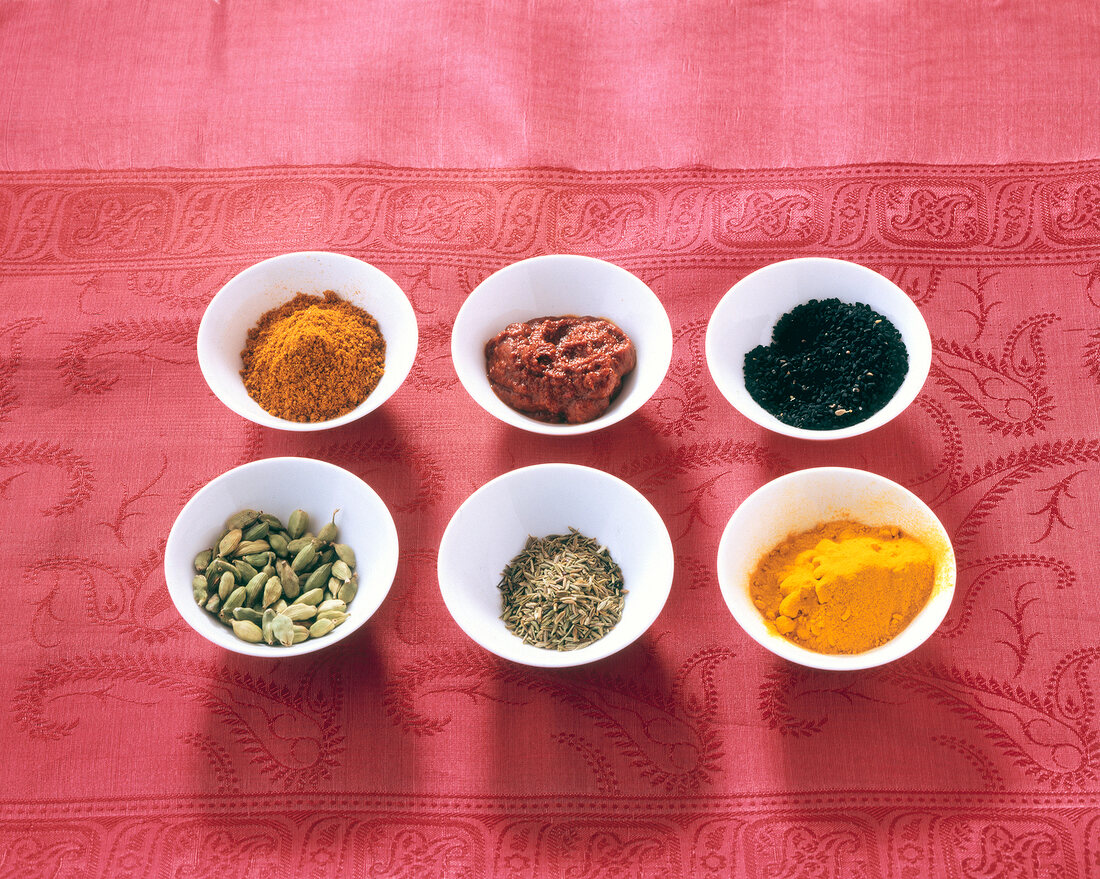 Ras-el-hanout, harissa, black sesame, turmeric, cumin and cardamom in bowls