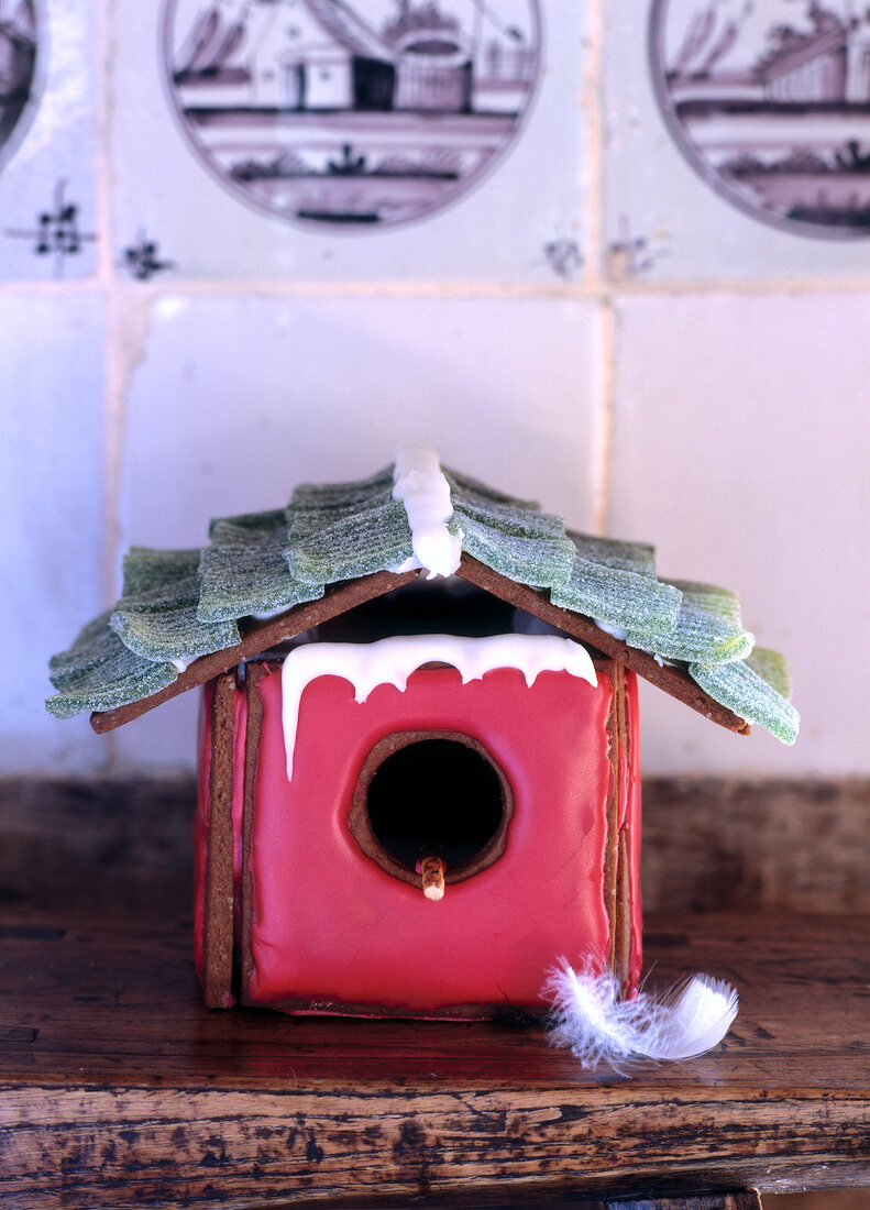 Close-up of red bird house shaped gingerbread