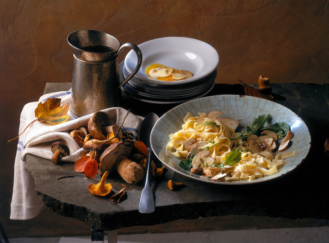 Thin slices of marinated porcini tagliatelle in serving dish