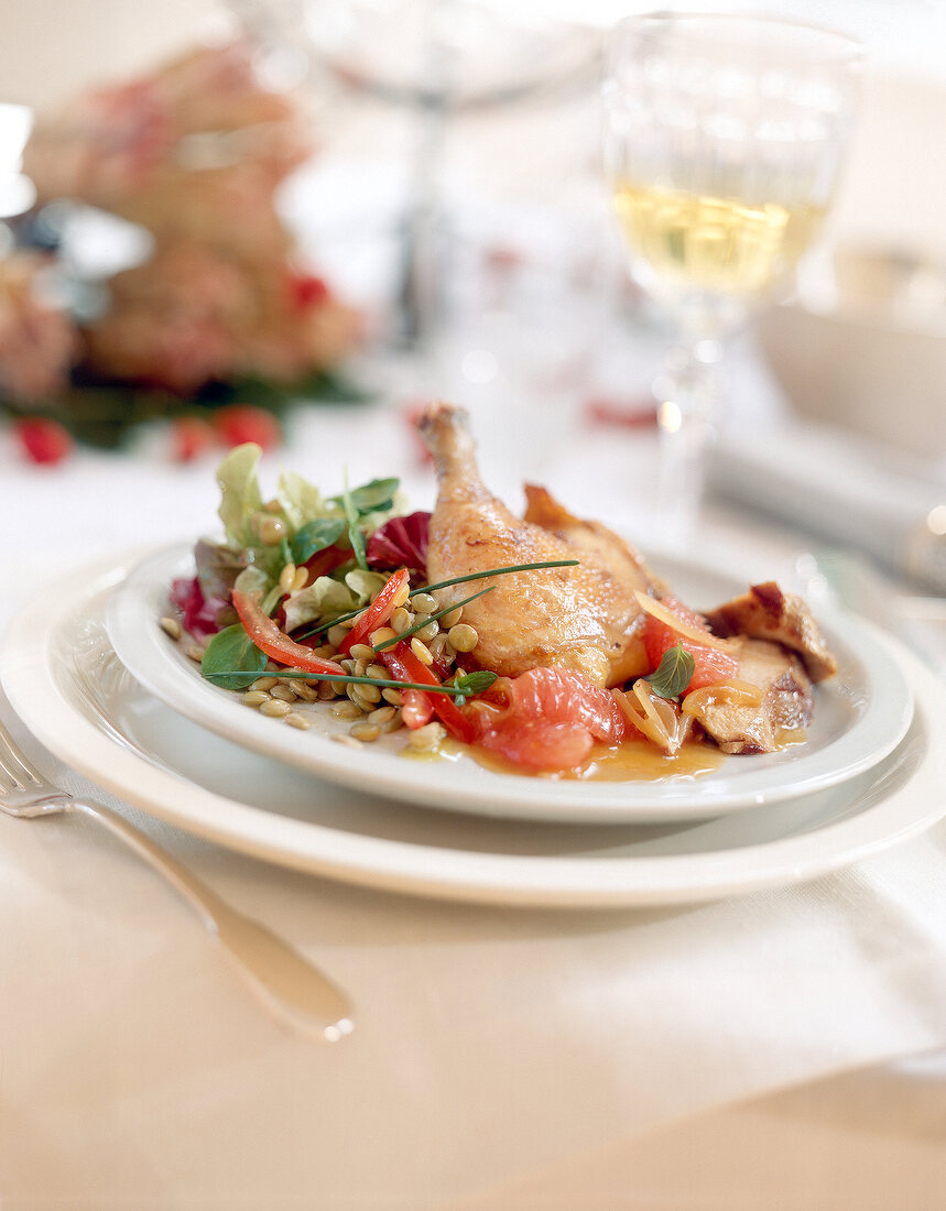 Pheasant with lentil salad on plate