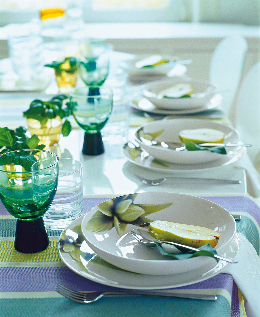 Table set with green and white crockery