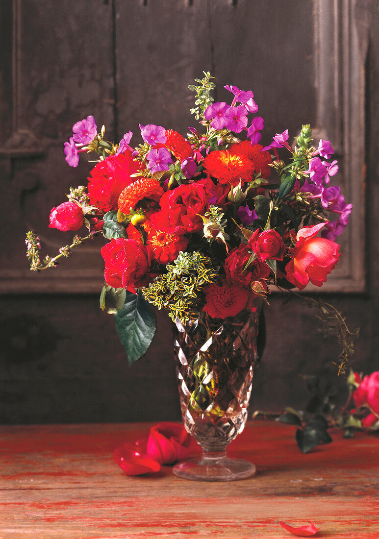 Vase decorated with bouquet of summer flowers