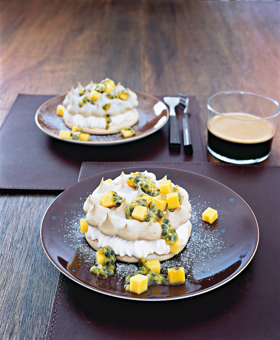 Mocha pavlovas with sugar foam on plate