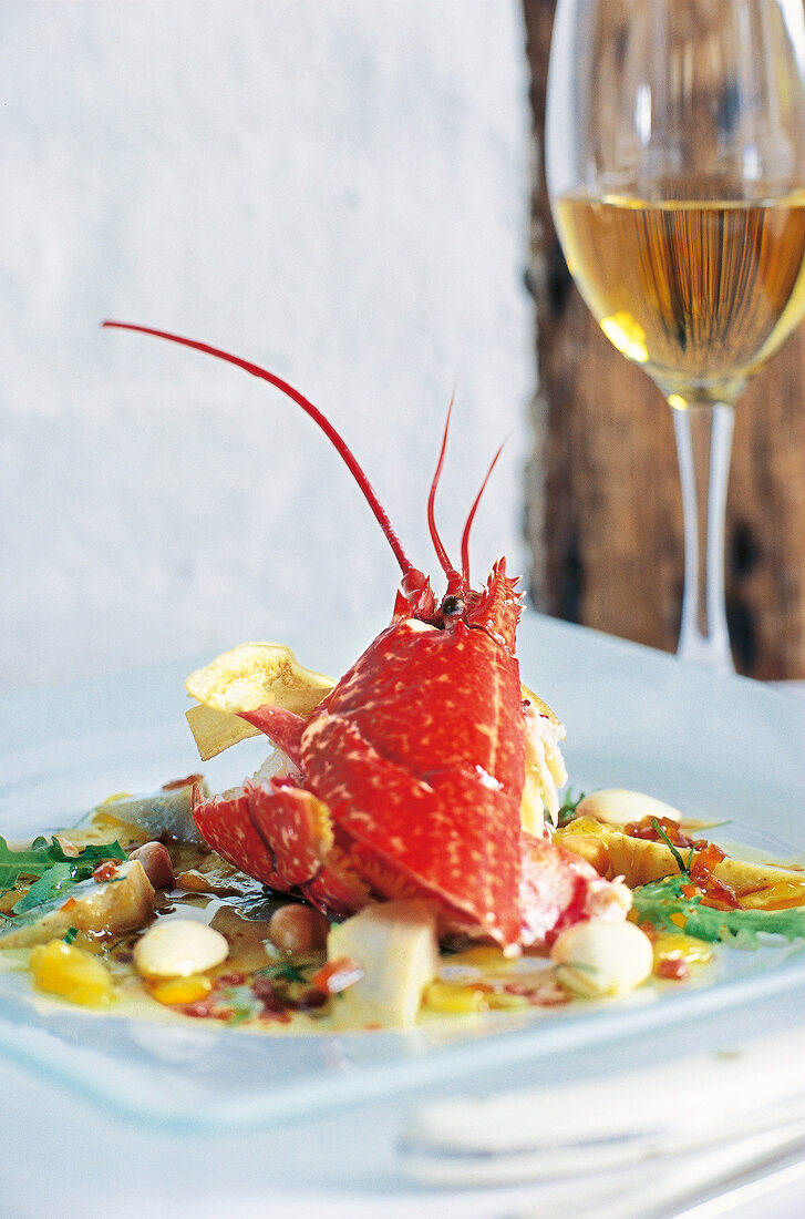 Lobster with mango dip and artichokes on plate