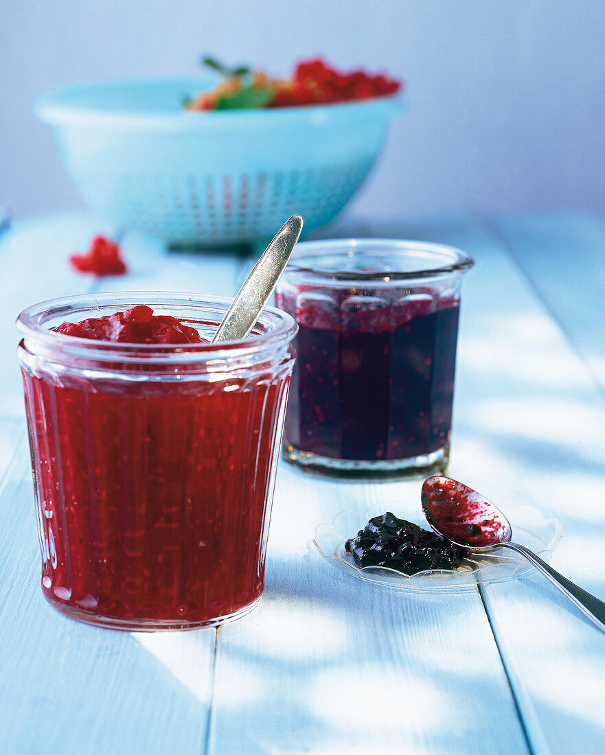 Blackberry, raspberry, blueberry and currant jam in glass jar