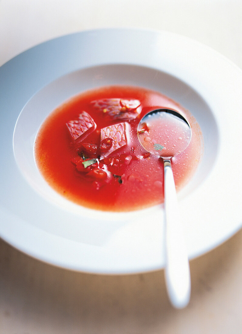 Cold tomato soup with red mullet in bowl