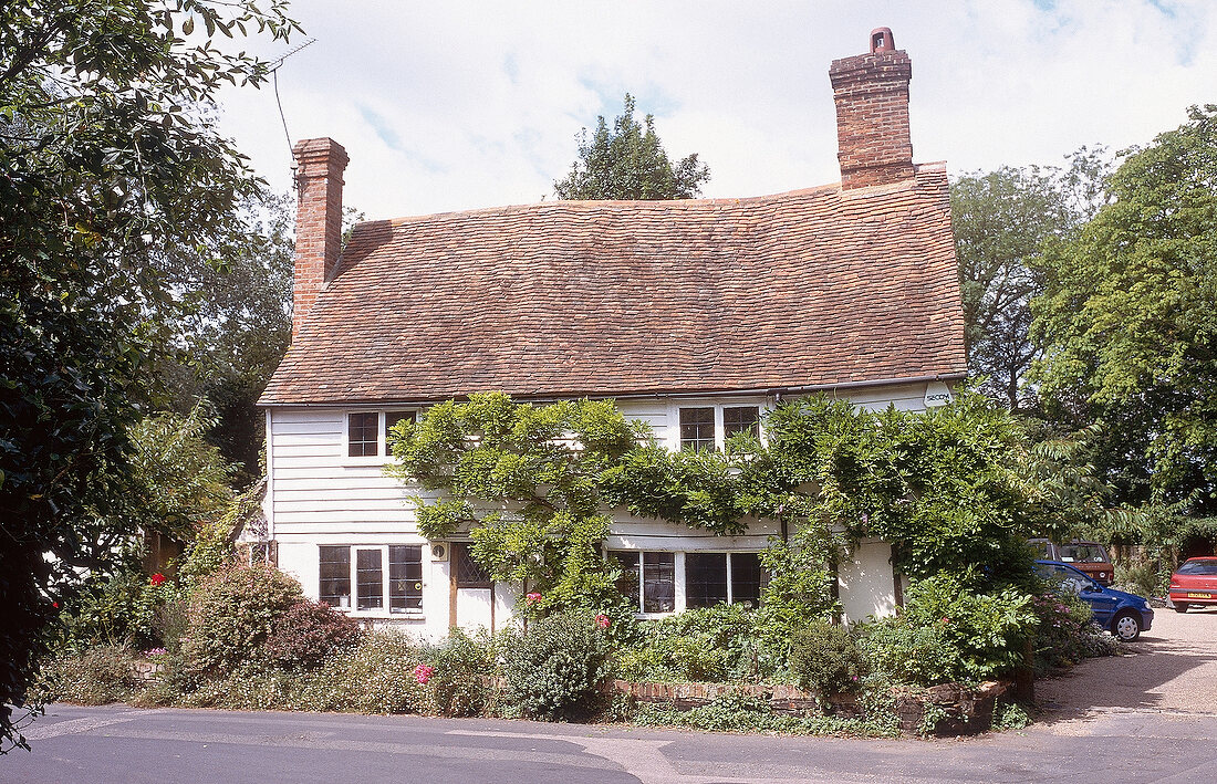 English house with red roof and chimney