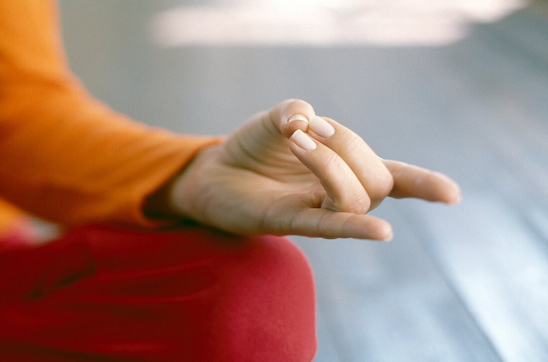 Close-up of hand mudra being performed for exercising finger