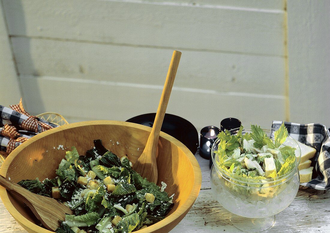 Caesar Salad in Wooden Bowl; Wooden Utensils