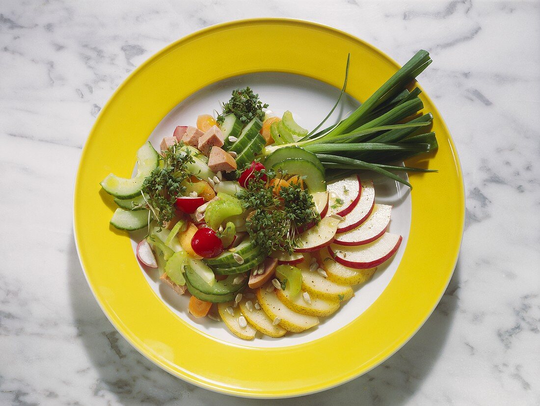 Colourful plate of raw vegetables