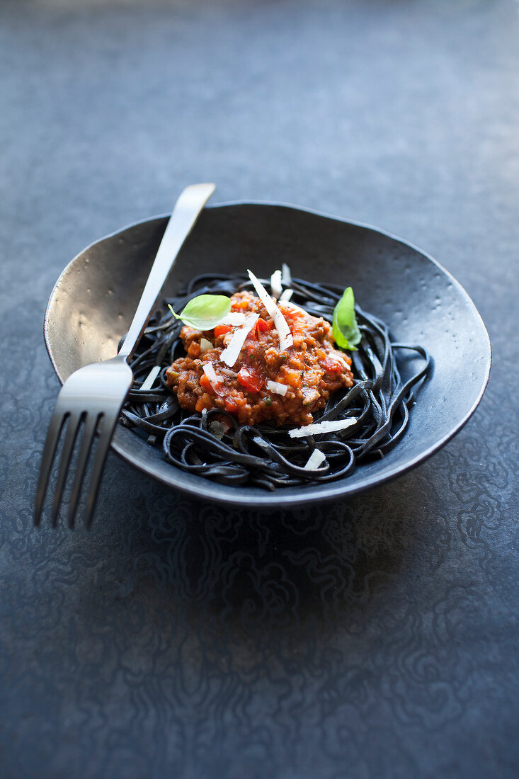 Black linguine with bolognese sauce