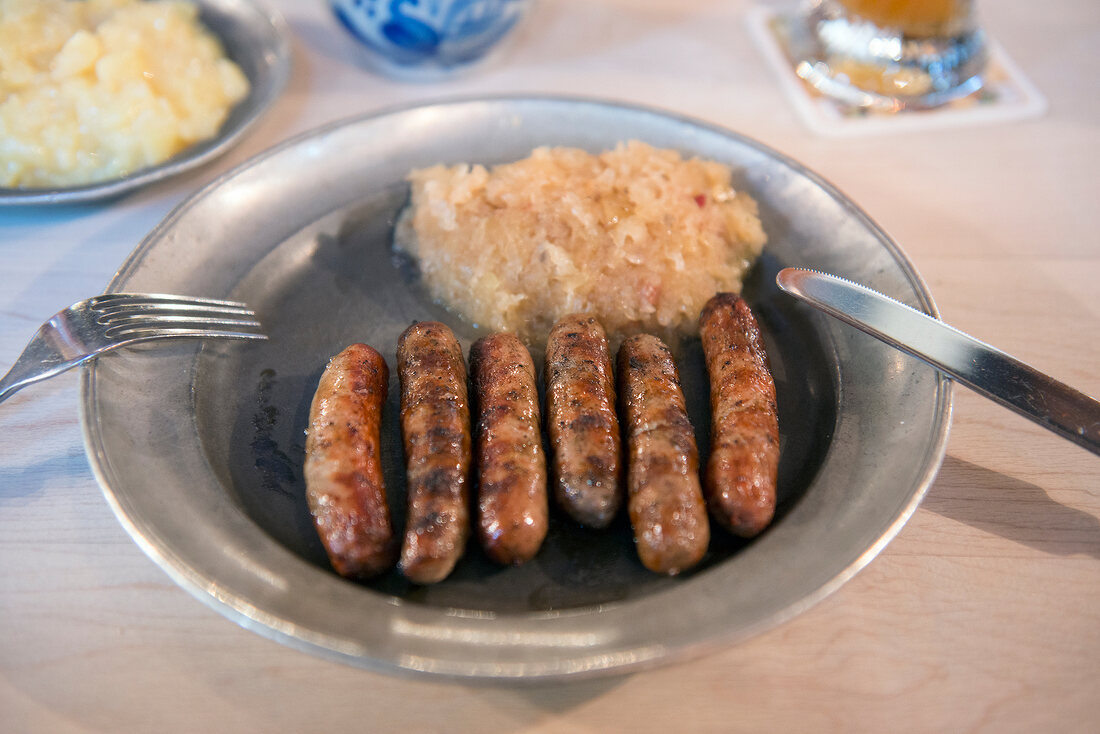 Grilled bratwurst sausages with sauerkraut