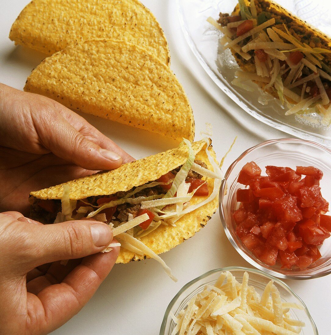 Making tacos with beef filling