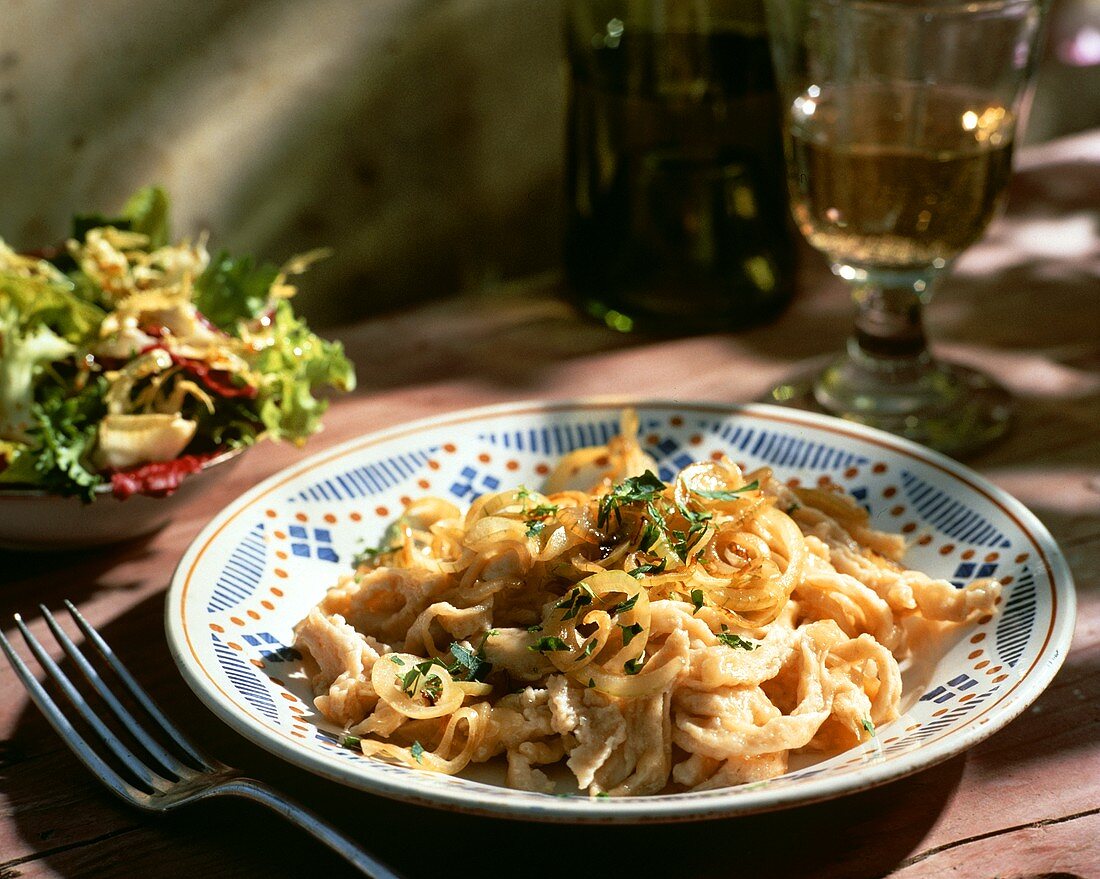 Noodles (Spaetzle) with onions and a mixed salad