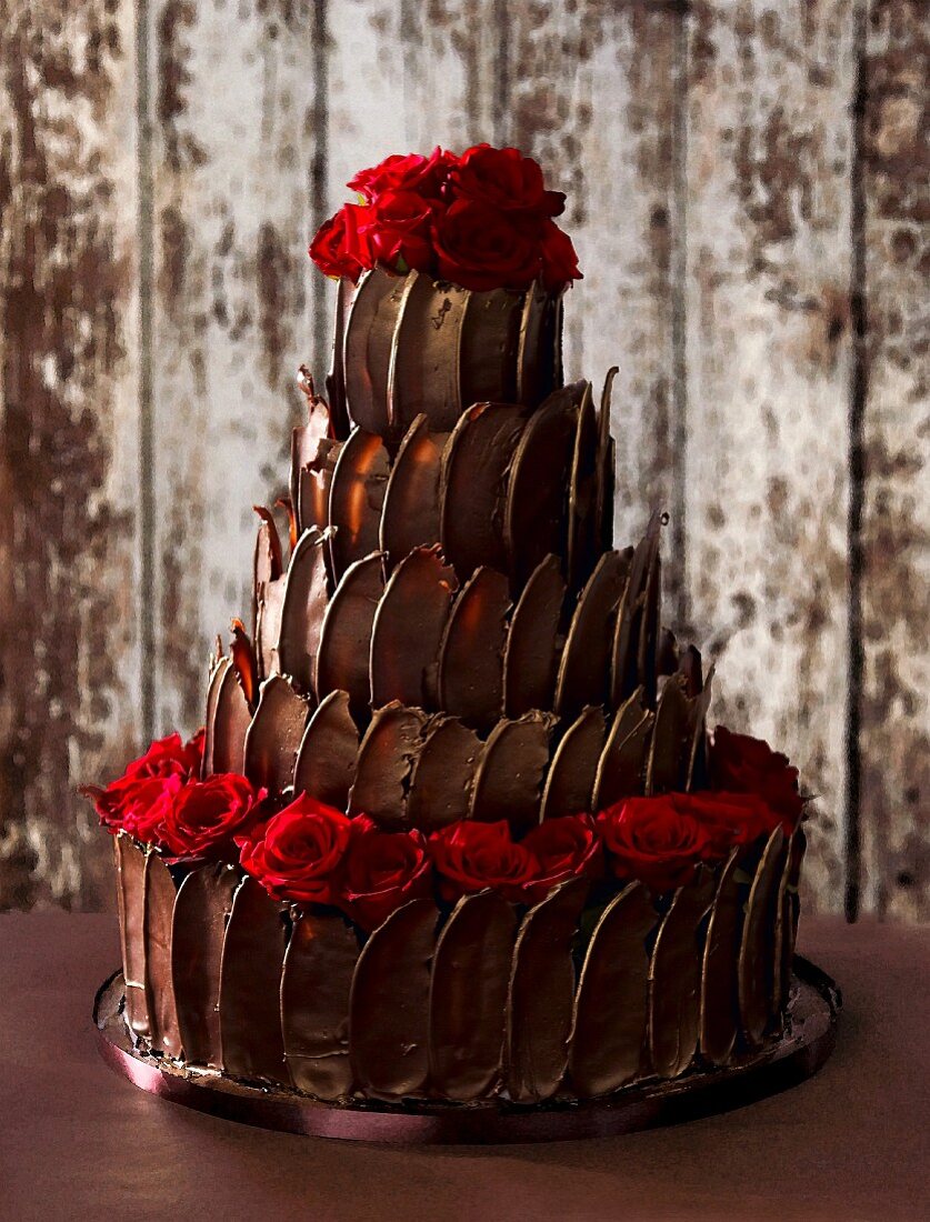 Five-tier truffle cake with roses for a wedding